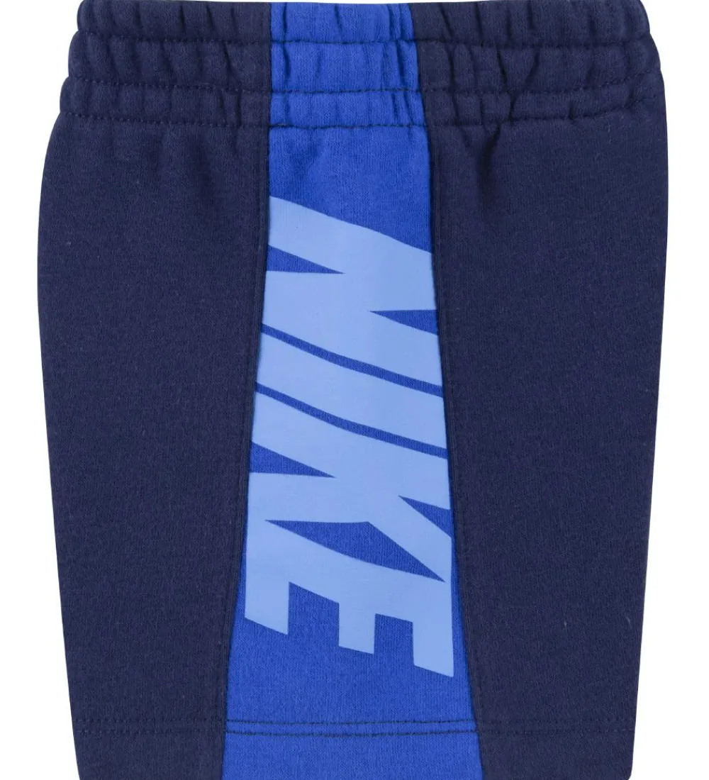 Nike Gymnastiktøj*Shortssæt - T-shirt/Shorts - Amplify - Midnight Navy